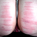 Fourth pic of SexPreviews - Harley Ace naked blonde is rope bound to black leather sofa and spanked red