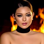 Third pic of Chelsie Aryn wearing only her sexy black stockings next to a fireplace