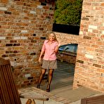 First pic of SuburbanAmateurs - Esther strips to her stockings and heels to finger her juicy cunt on the patio