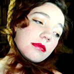 Third pic of Fetish freak Maggie Mead enjoys a bizarre bondage session as she is tied up and forced to work