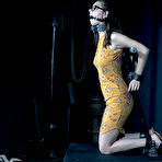 Third pic of SexPreviews - Shae Celestine in tight yellow dress is bound in wood and metal her pussy toyed