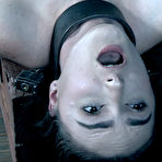 Second pic of SexPreviews - Luci Lovett busty brunette is metal bound to wooden pole in dark dungeon