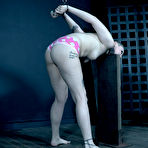 Third pic of SexPreviews - Arielle Aquinas sexy blonde is metal bound on wooden device in kinky dungeon