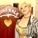 First pic of Big titted cougar takes on a black cock through a hole