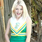 Second pic of Petite girl Holly Van Hough removes her cheerleader uniform and shows her teen pussy outdoors