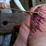 Fourth pic of Mistress Enza Brutally Canes Her Slave's Bare Ass! | CruelCity.com