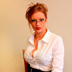 First pic of Busty glassed lady Holly Kiss in white blouse strips after painful cock punishment