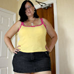 First pic of Chubby brunette with glasses Storm Cloud punishes a cock with her hands