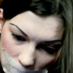 Fourth pic of Petite restrained brunette girl Sioux Sinner is absolutely helpless in the middle of the room