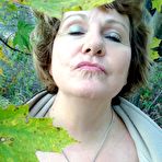 First pic of Busty Bliss Takes in the fall colors and poses in the trees