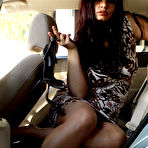 Third pic of Aria Giovanni in short dress takes off her shoes then exposes her legs and pussy