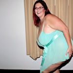 First pic of Four-eyed fattie Peaches Larue poses in lingerie and takes interracial breast cumshot