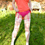 First pic of Pretty babe Cherry English flashes her goods parting nyloned legs outdoors