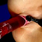 Second pic of Cassie Young with long sexy legs and tight bald pussy enjoys red robotic dildo in a blue room