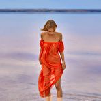 Second pic of Hannah Ray throws off her see through dress on the beach