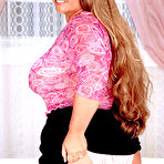 First pic of Long haired plumper Gina Marie La Montana exposes her tanlined huge tits and slit