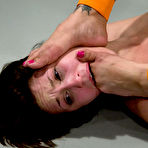 Fourth pic of Asian wrestler Dragon Lily inserts her fingers deep in helpless pussy of her opponent Ryan Keely