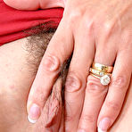 Third pic of Bosomy woman Lady Sonia stretching and finger fucking the hot hairy pussy