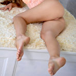 Second pic of Sexy girl's orange bodysuit didn't stay on for too long