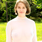 First pic of Young woman with big natural breasts posing near swimming pool
