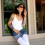 First pic of Long legged playful brunette Kayla Jane takes off her white stockings in public place