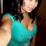 Third pic of 
        Busty brunette seductively posing and teasing photos    