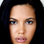 Fourth pic of Apolonia flaunts her smoking hot body and smooth pussy on the couch.