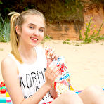 Third pic of Hottest Delicious sensual girl with adorable smile likes to have a good time by slowly taking off her tiny clothes to feel the sunshine. by ShavedTeenGirls.com