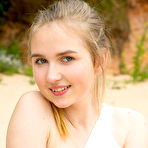 Fourth pic of Hottest Delicious sensual girl with adorable smile likes to have a good time by slowly taking off her tiny clothes to feel the sunshine. by ShavedTeenGirls.com