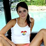 Second pic of Hottest Cute teenie brunette showing her fine body in the garden by ShavedTeenGirls.com