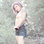 First pic of Naughty Joanna Angel with tattooed back double fingers her sexy asshole outdoors