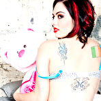 Third pic of Tattooed goth lady Taurus poses naked with plush teddy and fucks herself with black dildo