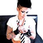 First pic of Alternative girl Jenna Sin strips out of her uniform and shows her round boobs