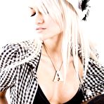Third pic of Slim blonde girl Ashlie goes topless and shows off her sexy tattooed back