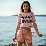First pic of Demi Fray poses gracefully lying naked on the rock in front of the sea