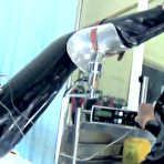 Second pic of mistresstokyovideo Mistress Tokyo - Rubber Domme with 12" Heel Fetish Boots, E-stim and Hitachi
