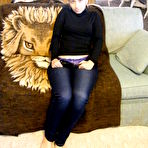 Fourth pic of taking pants off on the couch at HomeMoviesTube.com