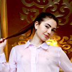 Second pic of Staffie strips her latex skirt as she displays her delectable pussy. naked