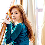 Second pic of Jia Lissa displays her petite body and pink cock sock on the chair. naked