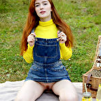 Second pic of Redhead Jia Lissa strips outdoors as she displays her trimmed pussy. naked