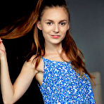 First pic of Sofi Shane bares her petite body and hairy pussy as she poses on the chair. naked