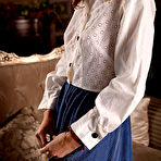 Second pic of Top model Maxa bares her sexy tanned body and smooth pussy on the couch. naked