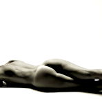 Third pic of A budy hugging teddy shows off the slender petite build that Laura Angelina is so proud of. She loves lingerie and the way it highlights her small boobs, but she's equally fond of taking it off so she can get down to business sliding her fingers up and down her bald meaty slit. naked