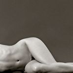 Fourth pic of A budy hugging teddy shows off the slender petite build that Laura Angelina is so proud of. She loves lingerie and the way it highlights her small boobs, but she's equally fond of taking it off so she can get down to business sliding her fingers up and down her bald meaty slit. naked