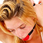 First pic of GagGirls.com | GG02 - Eva in red ball gag and handcuffs