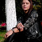 Second pic of Russian Smokers | Pretty faced Asya is smoking a cigarette outdoors