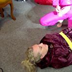 Second pic of Shinynylonartsbound | Sophie being overhelmed, tied and gagged with tape and a clothgag on on the floor from Ronja both wearing sexy shiny nylon downwear (Video)