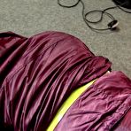 Fourth pic of Shinynylonartsbound | Sophie being overhelmed, tied and gagged with tape and a clothgag on on the floor from Ronja both wearing sexy shiny nylon downwear (Video)