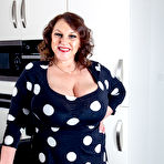 First pic of Naturally big breasted Carol Brown shows off her beautiful dress, and then some... - Free Mature.nl content