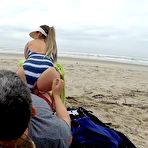 Fourth pic of Quickie on public beach, people walking near - Real Amateur - AmateurPorn